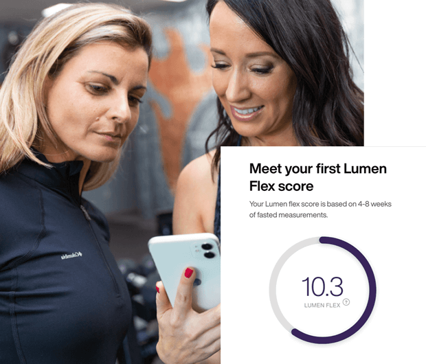 2 women in sportswear looking at Lumen app results